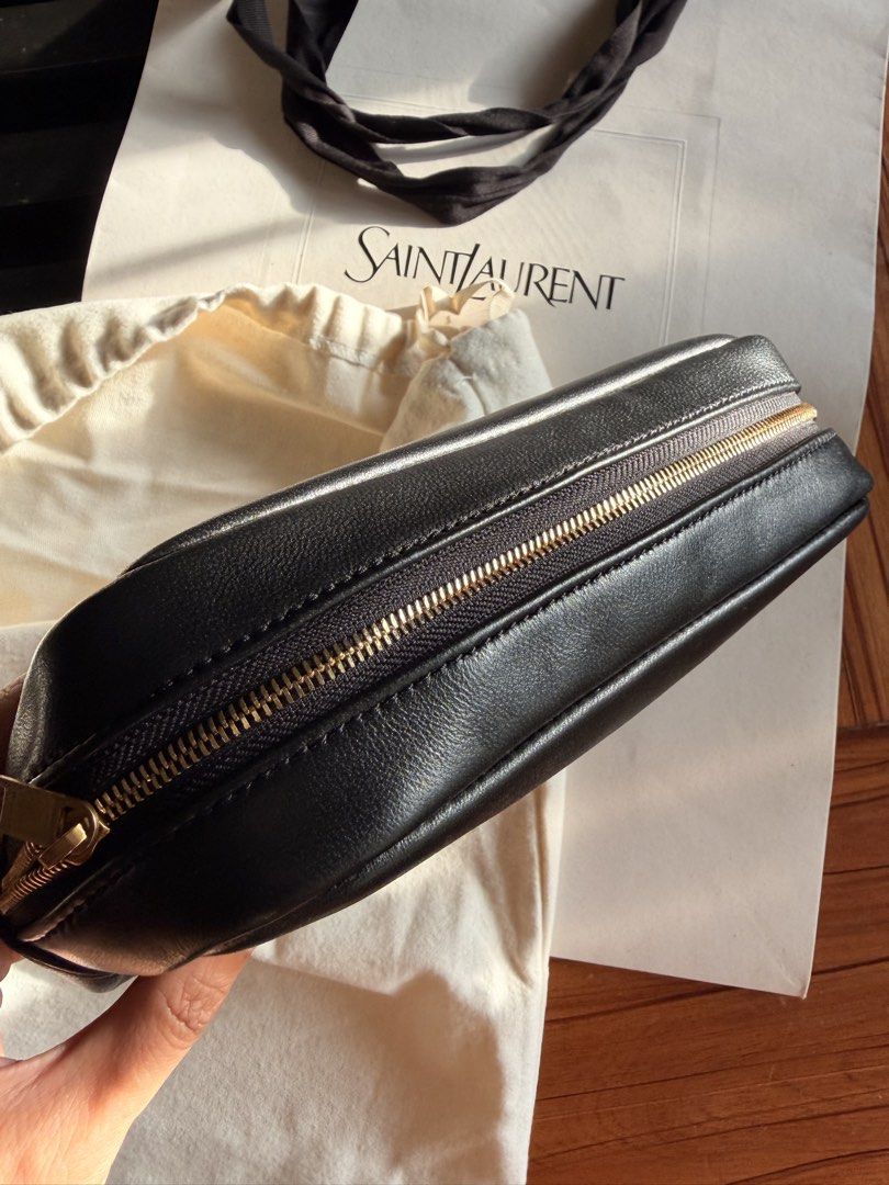 NO INCLUSIONS Saint Laurent Black Leather POUCH (Category: Cross-body Bags) located in Las Pinas. Submitted by twiceloved24 (Listing ID 1466872403, Image 2). Description: - Elegant gold-tone hardware featuring the iconic front YSL logo - Secure zip-top closure with a clean black fabric-lined interior - Built-in interior card slots and Saint Laurent Paris leather tag - Includes original dust bag and shopping bag - Condition: Excellent, well-mainta
