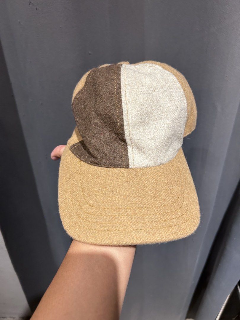 Octobre Editions Colorblock Wool Cap Hat (Category: Hats & Beanies) located in Dipolog. Submitted by adrian281994 (Listing ID 1466876600, Image 1). Description: - Brand: Octobre Éditions (Sézane) - Design: Earth-toned colorblock (brown, cream, and tan) - Material: Premium wool fabric blend with black interior lining - Closure: Adjustable leather strap with a durable brass buckle - Condition: Like new, worn only a couple of times - Style: Great tr