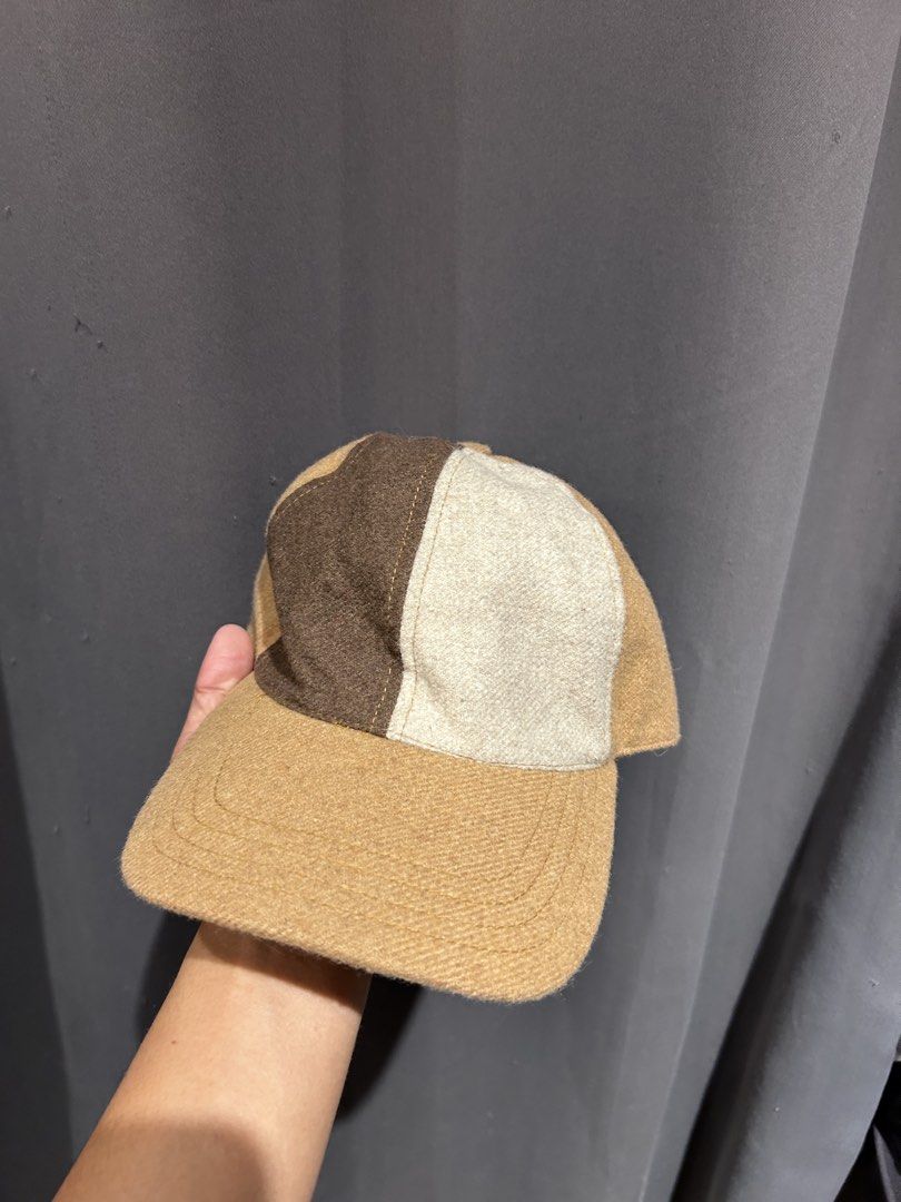 Octobre Editions Colorblock Wool Cap Hat (Category: Hats & Beanies) located in Dipolog. Submitted by adrian281994 (Listing ID 1466876600, Image 3). Description: - Brand: Octobre Éditions (Sézane) - Design: Earth-toned colorblock (brown, cream, and tan) - Material: Premium wool fabric blend with black interior lining - Closure: Adjustable leather strap with a durable brass buckle - Condition: Like new, worn only a couple of times - Style: Great tr