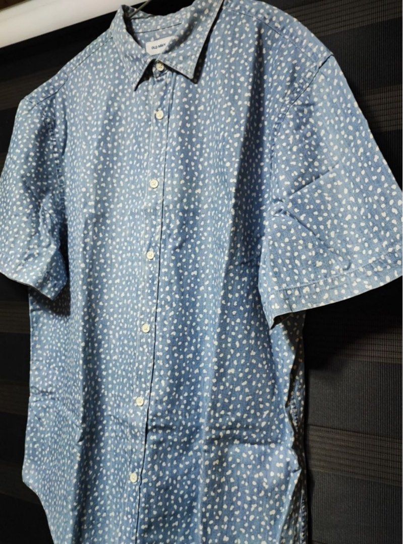 Old Navy Blue White Dot Short Sleeve Polo (Category: Formal Shirts) located in Pasig City. Submitted by abogadosupremo (Listing ID 1466961761, Image 2). Description: - Brand: Old Navy - Style: Short sleeve polo shirt with button-down front and collar - Design: Light blue denim-look fabric with small white polka dots - Fit: Standard slim fit - Condition: Clean, no stains or rips - Ideal for: Casual everyday wear - THIS IS LEGIT AND ORIGINAL - VERY