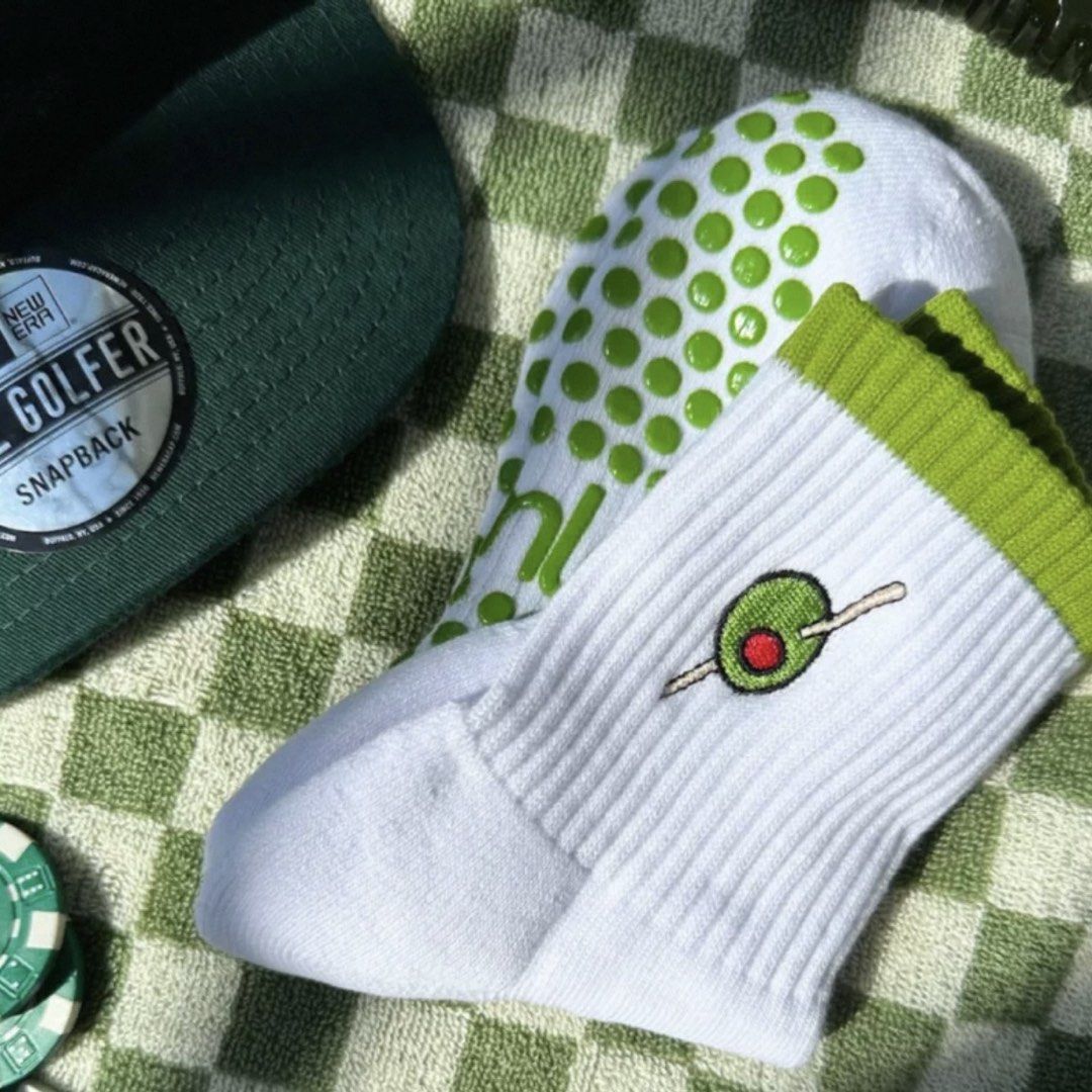 Olive Grip Socks (Yoga/Pilates Socks) (Category: Activewear) located in Quezon City. Submitted by averioph (Listing ID 1466849858, Image 1). Description: - Brand new and 100% unused condition - New Era green cap complete with The Golfer sticker - White grip socks with stylish green trim - Detailed embroidered olive accent near the top - Green rubber soles for enhanced traction and stability.