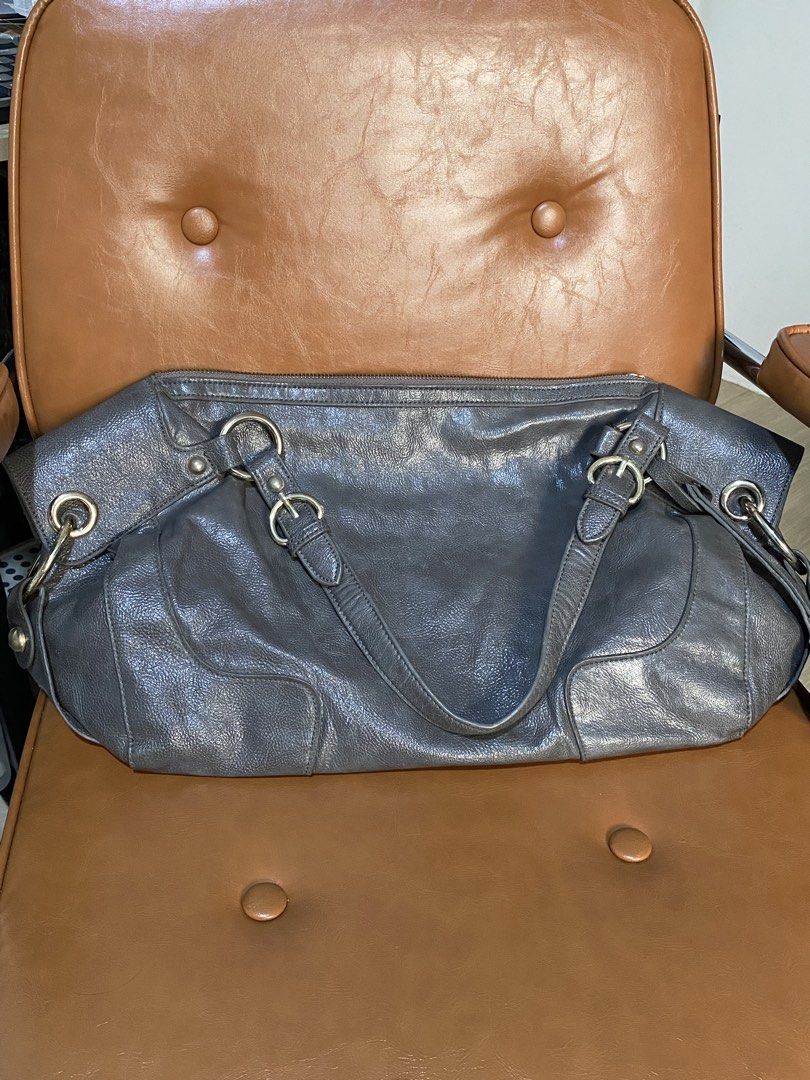 Authentic Olivia Lauren Leather Bag (Category: Tote Bags) located in Pasig City. Submitted by talaversify (Listing ID 1466882331, Image 1). Description: Brand: Authentic Olivia Lauren Shoulder Bag in excellent condition. Material: 💯 Genuine Leather Color: Charcoal Gray/Slate Hardware: Polished Silver-Tone (Rings, Buckles, and Stud Accents) .