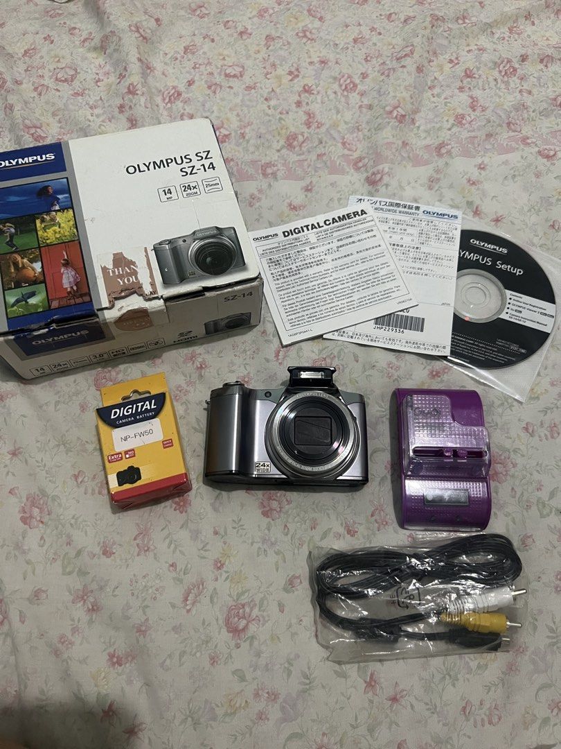 Olympus SZ-14 WITH POP UP FLASH (Category: Cameras) located in Manila. Submitted by mijareszophia8 (Listing ID 1466922773, Image 1). Description: ★ Olympus SZ-14 📸 ╰─➤ ₱7,999 FIXED! ✨ ✨ WITH POP-UP FLASH! 🔥 NO ISSUES CAN PASS AS BRAND NEW 📸 Features: • 14MP CCD Sensor • 24x Optical Zoom • Pop-Up Flash • HD Video Recording • Compact & Travel-Friendly Design • Great for Everyday Shots & Vintage Digicam Aesthetic 🤍 📦 Inclusions: • Z Clicks Pape