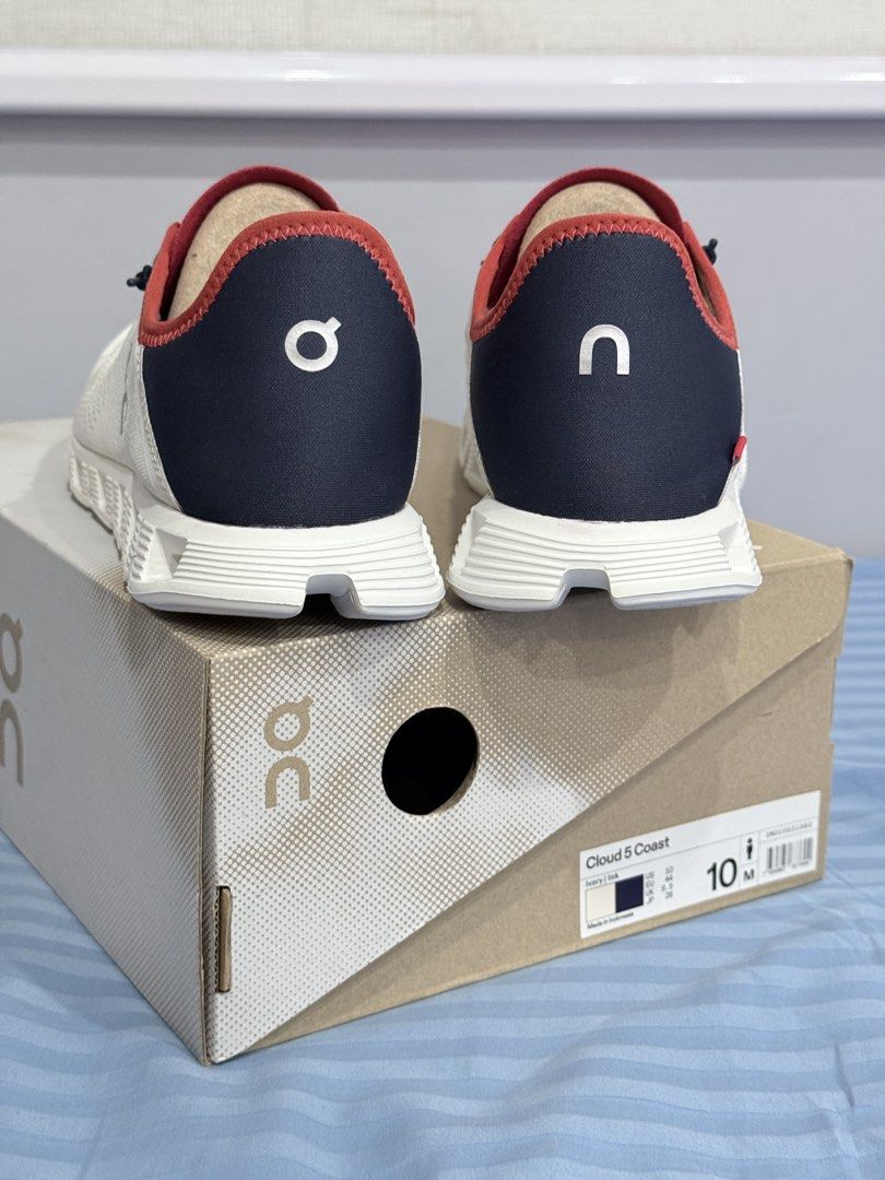 On Cloud 5 Coast Ivory Ink Men Size 10 (Category: Sneakers) located in Manila. Submitted by altabl123 (Listing ID 1466785341, Image 3). Description: On Cloud 5 Coast sneakers in Ivory and Ink colorway. Men size 10 US, EU 44, UK 9.5. Breathable mesh upper with bungee speed-lacing system. Navy and red details near the collar. Original shoe box included..