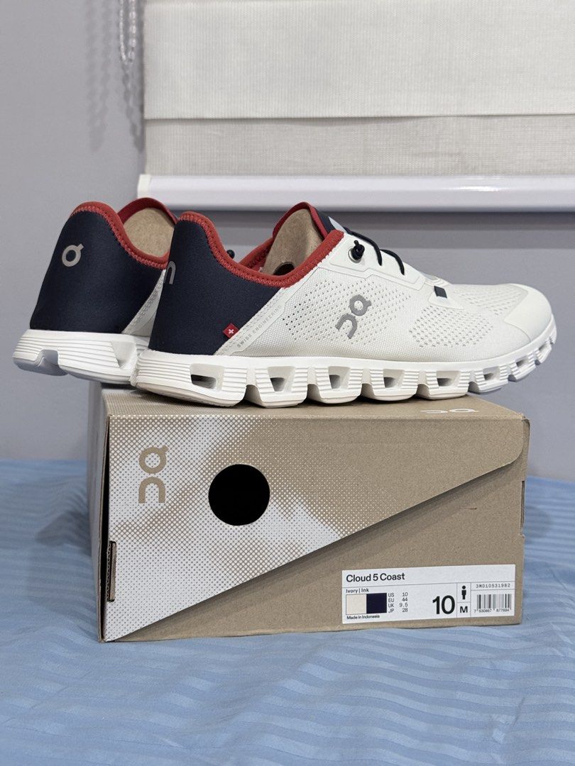 On Cloud 5 Coast Ivory Ink Men Size 10 (Category: Sneakers) located in Manila. Submitted by altabl123 (Listing ID 1466785341, Image 2). Description: On Cloud 5 Coast sneakers in Ivory and Ink colorway. Men size 10 US, EU 44, UK 9.5. Breathable mesh upper with bungee speed-lacing system. Navy and red details near the collar. Original shoe box included..