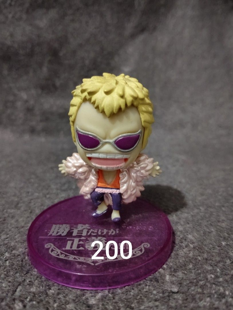 One Piece Donquixote Doflamingo Chibi Mini Figures (Category: Figurines & Statues) located in Quezon City. Submitted by johnoppais84003 (Listing ID 1466881114, Image 1). Description: Donquixote Doflamingo chibi figures from One Piece - Includes various dynamic poses: open arms, crouching, and pointing - Stands on colored bases with printed name plates - Heights range from 100 to 200 based on numbered bases - Great addition for anime collectors - 