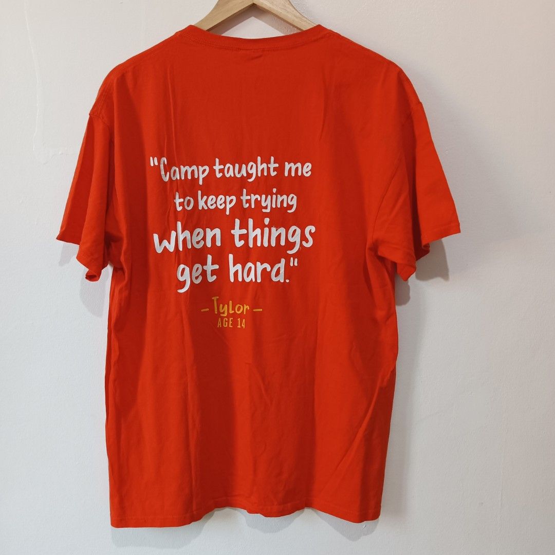 Orange Graphic T-Shirt | L (Category: Tshirts & Polo Shirts ) located in Subic. Submitted by mustardt_ (Listing ID 1466781265, Image 2). Description: Vibrant orange crew-neck promotional/charity t-shirt from Tim Hortons Camp Day. size: 21in x 28.5in code: c789.