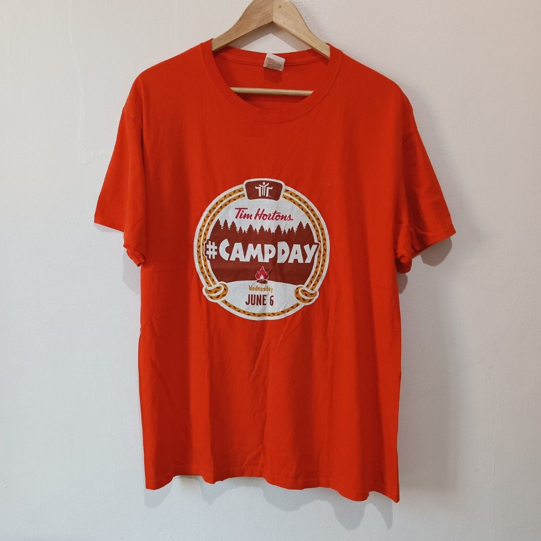 Orange Graphic T-Shirt | L (Category: Tshirts & Polo Shirts ) located in Subic. Submitted by mustardt_ (Listing ID 1466781265, Image 1). Description: Vibrant orange crew-neck promotional/charity t-shirt from Tim Hortons Camp Day. size: 21in x 28.5in code: c789.