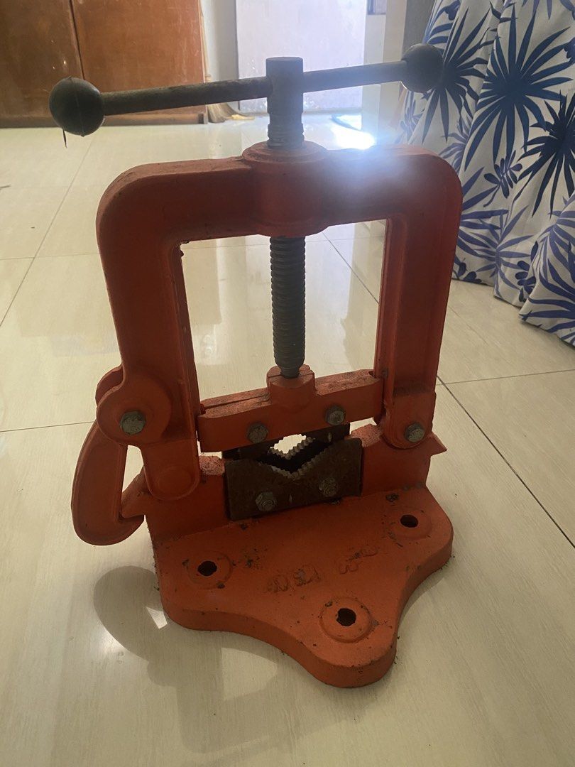 Orange Heavy Duty Hinged Pipe Vise Bench Yoke (Category: Construction Tools & Equipment) located in Quezon City. Submitted by freeocean.f71c47 (Listing ID 1466843725, Image 1). Description: - Heavy-duty cast iron construction in a bright orange finish - Steel jaws with teeth for a secure, non-slip grip on pipes - Smooth-working threaded screw handle for easy adjustment - Base includes mounting holes for stable workbench installation - Convenient 
