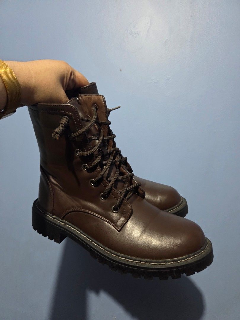 ORIGINAL Dark Brown Combat Boots Size 38 (Category: Boots) located in Manila. Submitted by misakicakes (Listing ID 1466892281, Image 2). Description: - Size: 38 (marked on sole) - Color: Dark brown - Material: Smooth synthetic leather upper with contrast stitching - Design: Chunky lug soles, lace-up closure, and side zippers for easy wearing - Condition: Minimal wear on treads, clean interior and exterior - Style: Great everyday boots for casual 
