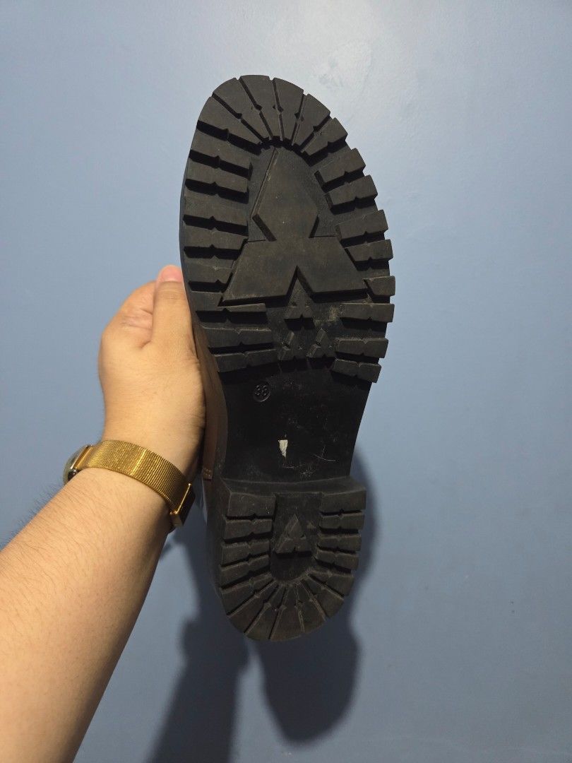 ORIGINAL Dark Brown Combat Boots Size 38 (Category: Boots) located in Manila. Submitted by misakicakes (Listing ID 1466892281, Image 3). Description: - Size: 38 (marked on sole) - Color: Dark brown - Material: Smooth synthetic leather upper with contrast stitching - Design: Chunky lug soles, lace-up closure, and side zippers for easy wearing - Condition: Minimal wear on treads, clean interior and exterior - Style: Great everyday boots for casual 
