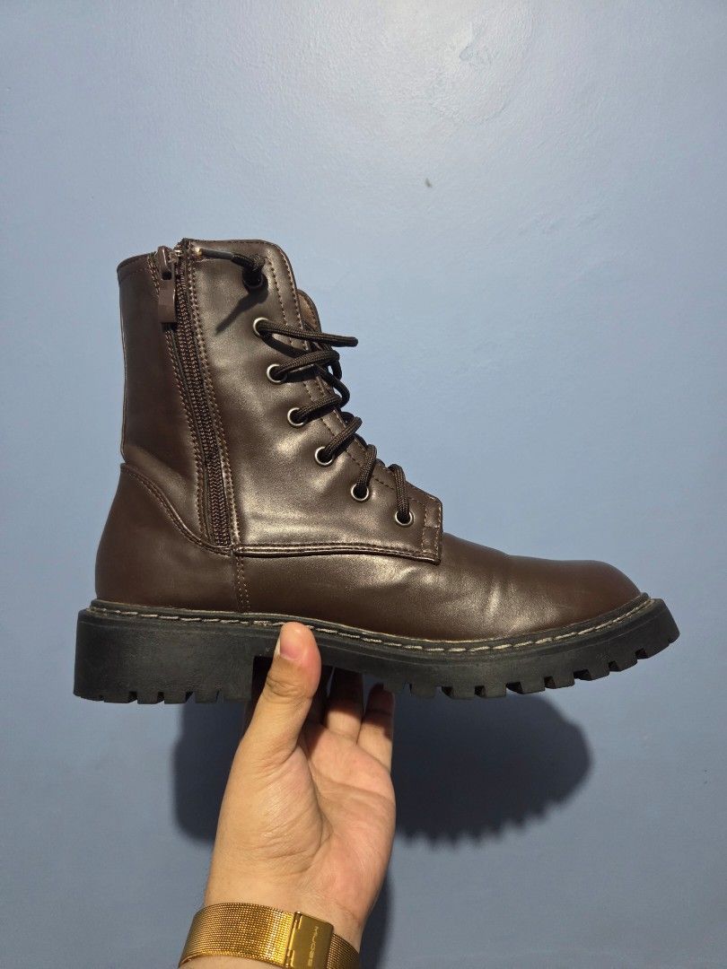 ORIGINAL Dark Brown Combat Boots Size 38 (Category: Boots) located in Manila. Submitted by misakicakes (Listing ID 1466892281, Image 1). Description: - Size: 38 (marked on sole) - Color: Dark brown - Material: Smooth synthetic leather upper with contrast stitching - Design: Chunky lug soles, lace-up closure, and side zippers for easy wearing - Condition: Minimal wear on treads, clean interior and exterior - Style: Great everyday boots for casual 