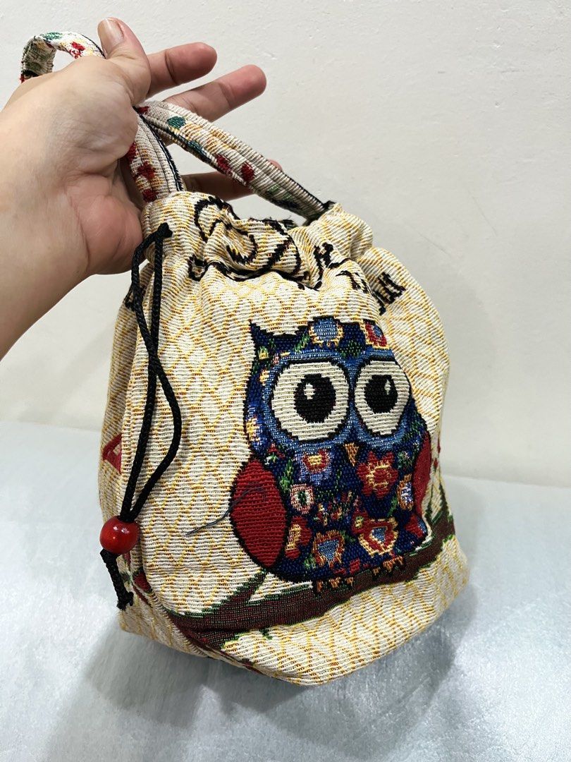 Owl Tapestry Backpack and Drawstring Handbag Set (Category: Backpacks) located in Talisay. Submitted by cherylu (Listing ID 1466939033, Image 3). Description: - Set of 2 matching owl tapestry bags in a cute boho style - Material: Woven fabric with a versatile cream background - Backpack: Features 4 colorful owls on branches, adjustable straps, and a secure zip closure - Drawstring Bucket Handbag: Features a single blue owl design with convenient 