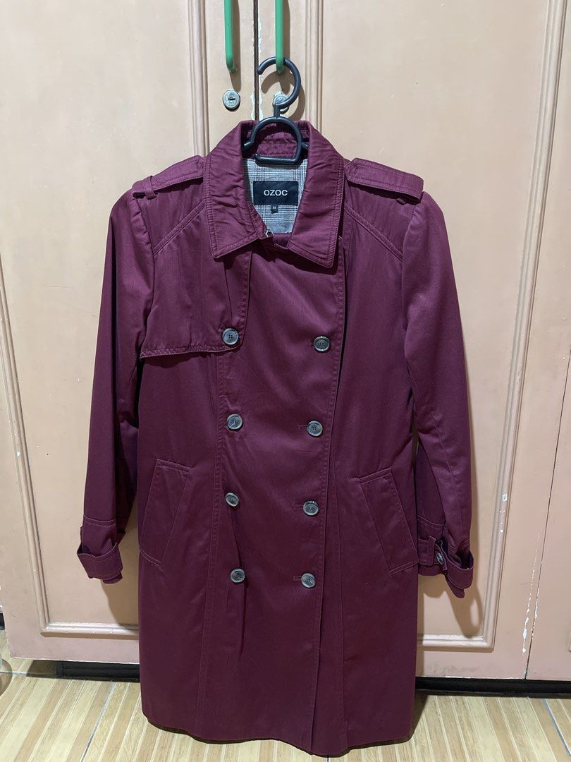 OZOC Maroon Double-Breasted Trench Coat Size 55 (Category: Coats, Jackets and Outerwear) located in Quezon City. Submitted by donnabelle7572 (Listing ID 1466887348, Image 1). Description: - Brand: OZOC - Size: 55 - Color: Rich maroon / deep burgundy wine - Style: Double-breasted trench coat with classic fit - Features: Matching belt, shoulder epaulets, storm flap, and two side pockets - Details: Chic plaid lining inside collar and upper back, plu