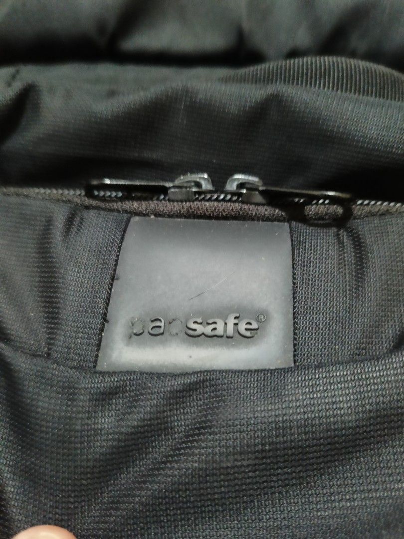 Pacsafe LS450 Anti-Theft Black Backpack (Category: Backpacks) located in Quezon City. Submitted by jdwoah12 (Listing ID 1466820261, Image 3). Description: - Brand: Pacsafe - Color: Black - Condition: Clean, excellent everyday travel bag - Security: Built with anti-theft secure zippers - Material: Durable dark fabric - Organization: Multiple zippered compartments on front and sides - Comfort: Padded shoulder straps and back panel.