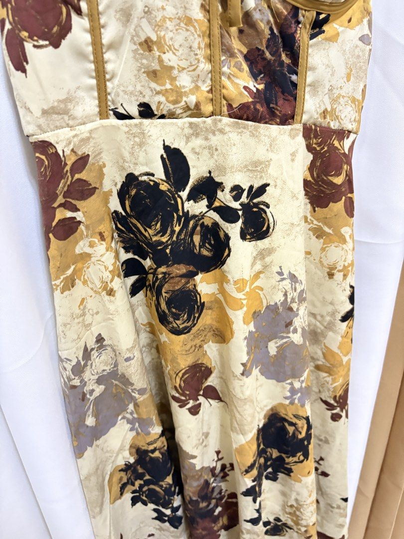 Padded Dress from BKK (Category: Dresses) located in Malolos. Submitted by deffnotandwie (Listing ID 1466898020, Image 2). Description: - Style: Vintage-inspired floral midi dress - Color: Cream with brown, black, and mustard print - Straps: Thick mustard straps with cute bow ties - Fit: Smocked elastic back panel for extra comfort.