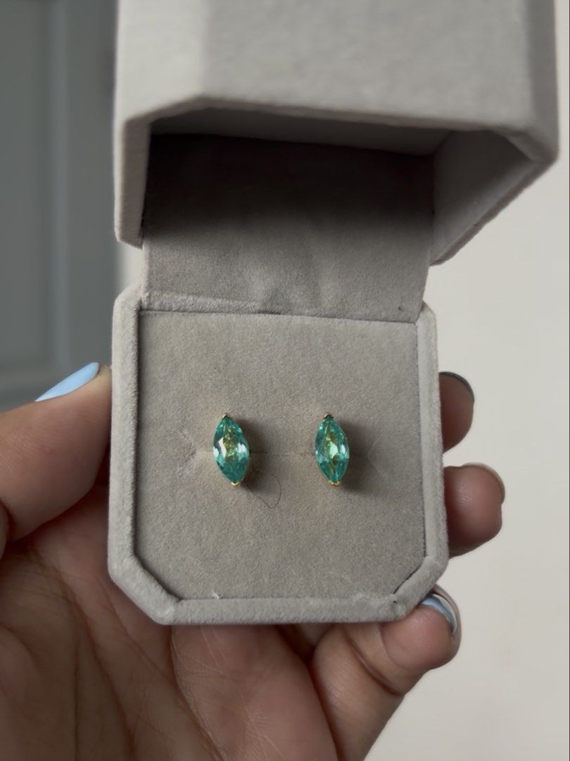 Paraiba Marquise cut earrings (Category: Earrings) located in Rizal. Submitted by katmandulovesmakeup (Listing ID 1466817659, Image 1). Description: Paraiba Marquise cut earrings (lab grown) S925 silver in gold setting 1ct per earring.