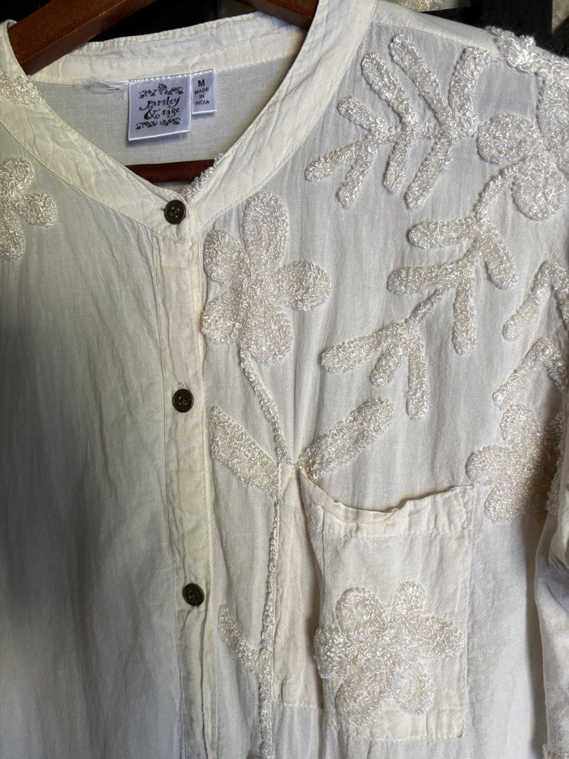 Parsley & Sage Embroidered Button-Down Blouse Size M (Category: Blouses) located in Batangas. Submitted by purple_and_orange (Listing ID 1466828994, Image 3). Description: - Brand: Parsley & Sage - Size: Medium (Made in India) - Material: 100% Cotton - Color: Off-white with beautiful tonal floral and vine embroidery - Features: Mandarin collar, front button closure, single chest pocket, and long sleeves - Care: Hand wash recommended - Condition: 
