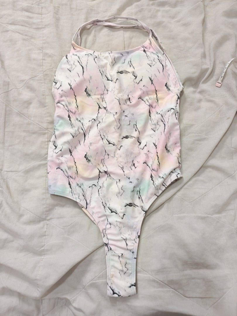 Pastel marble Halter one-piece swimsuit (Category: Bikinis & Swimsuits) located in Antipolo. Submitted by _suspiria (Listing ID 1466778860, Image 1). Description: - Style: Halter neck one-piece swimsuit with thin straps - Design: Trendy high-cut leg and colorful pastel marble pattern - Details: Soft material featuring unique black vein accents mixed with pink, yellow, and green tones - Occasion: Ideal for beach getaways, pool parties, and vacatio