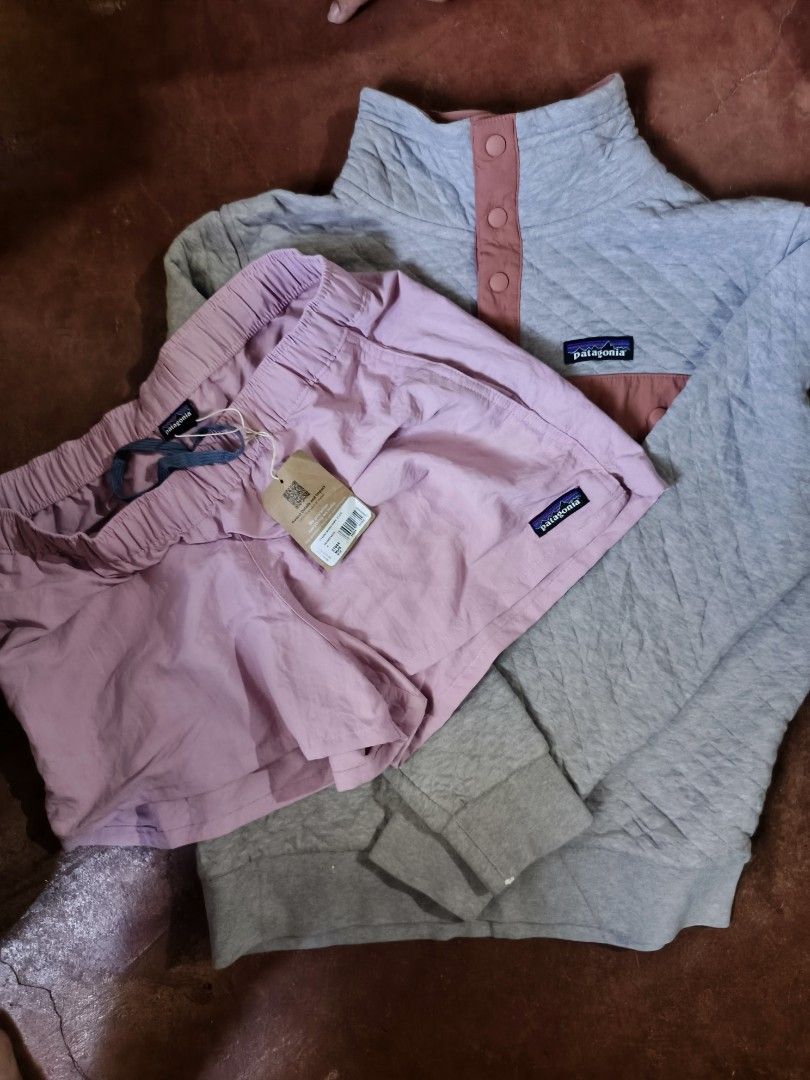Patagonia Quilted Pullover and Pink Shorts Set (Category: Sets or Coordinates) located in Gumaca. Submitted by makuliti (Listing ID 1466785352, Image 1). Description: - Authentic Patagonia bundle for women - Grey quilted pullover with snap buttons and classic logo patch - Pink outdoor shorts with elastic drawstring waist and original store tag still attached - Great gear for hiking, camping, or casual everyday wear.