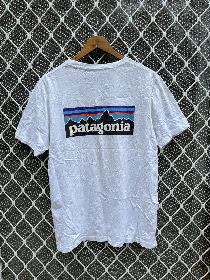 Patagonia White Responsibili-Tee with Back Logo (Category: Tshirts & Polo Shirts ) located in Panaon. Submitted by adrian_galope. (Listing ID 1466796778, Image 2). Description: - Brand: Patagonia - Item: Responsibili-Tee - Color: White - Fit: Standard fit, short sleeves, crew neck - Details: Small logo on chest, large mountain graphic on the back - Material: 100% organic cotton - Origin: Made in Mexico - Condition: Brand new with interior tags at