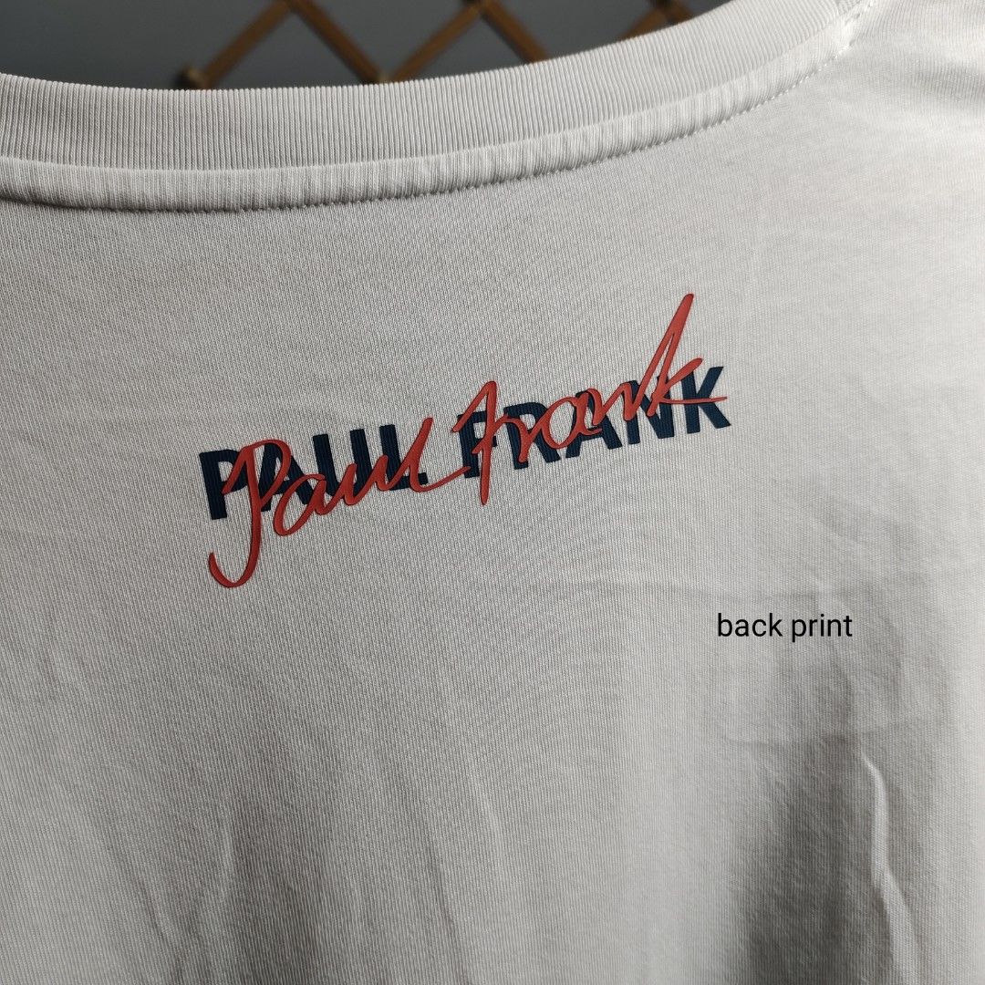 Paul Frank Graphic Tee (Category: Tshirts & Polo Shirts ) located in Tayabas. Submitted by lorrena (Listing ID 1466963013, Image 2). Description: - Size: Oversized fit (Best fits XXL to XXXL) - Color: White with colorful front graphic print - Details: Clean Paul Frank red and navy back print, plus a signature rainbow side seam tag - Material: Comfortable, breathable cotton - Style: Relaxed streetwear.