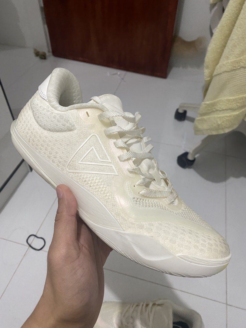 Peak taichi supreme low v2 all white (Category: Activewear) located in Binan City. Submitted by couchpotatocla (Listing ID 1466907353, Image 3). Description: - Brand: Peak - Colorway: All-White - Material: Knit upper with supportive synthetic overlays - Closure: Standard lace-up - Details: Branded triangular logo on the side panel - Condition: Clean overall - Inclusions: Original purchase receipt included (dated October 2026).