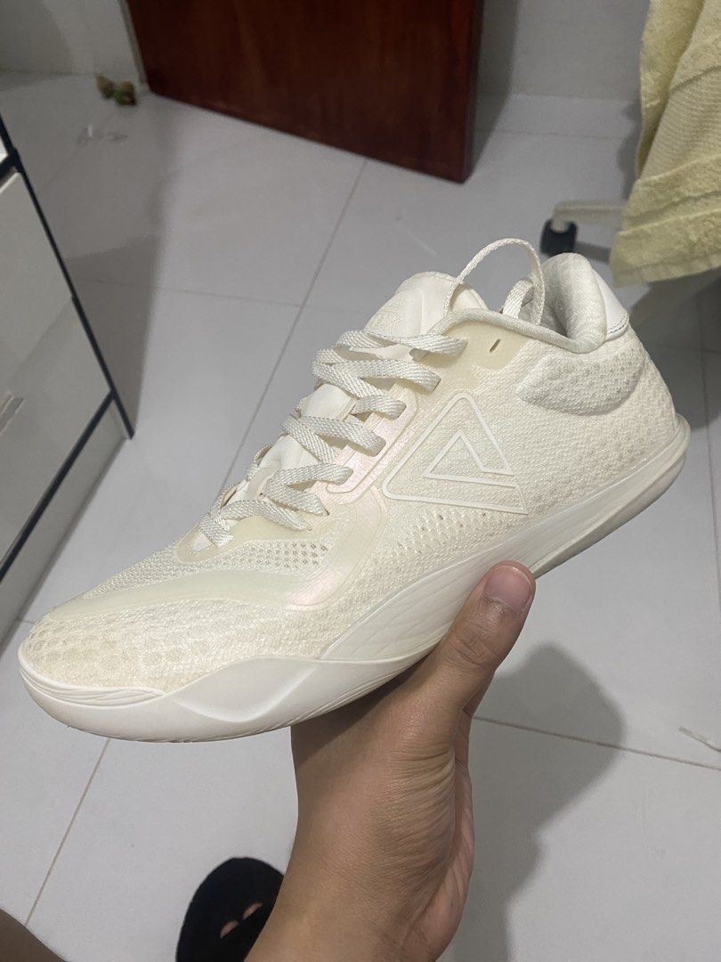 Peak taichi supreme low v2 all white (Category: Activewear) located in Binan City. Submitted by couchpotatocla (Listing ID 1466907353, Image 2). Description: - Brand: Peak - Colorway: All-White - Material: Knit upper with supportive synthetic overlays - Closure: Standard lace-up - Details: Branded triangular logo on the side panel - Condition: Clean overall - Inclusions: Original purchase receipt included (dated October 2026).