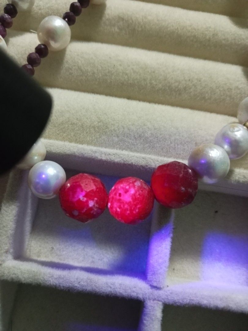 Pearl and Ruby Beaded Necklace with Silver Clasp (Category: Necklaces) located in Davao. Submitted by kimpoycaye62726 (Listing ID 1466943644, Image 2). Description: - Handmade collarbone-length necklace - Features white freshwater pearls and dark red Ruby beads - Centerpiece: 3 large faceted ruby statement beads - Accented with small gold-tone spacer beads - Secured with a silver-toned metal clasp - Clean condition, safely stored in a jewelry tra