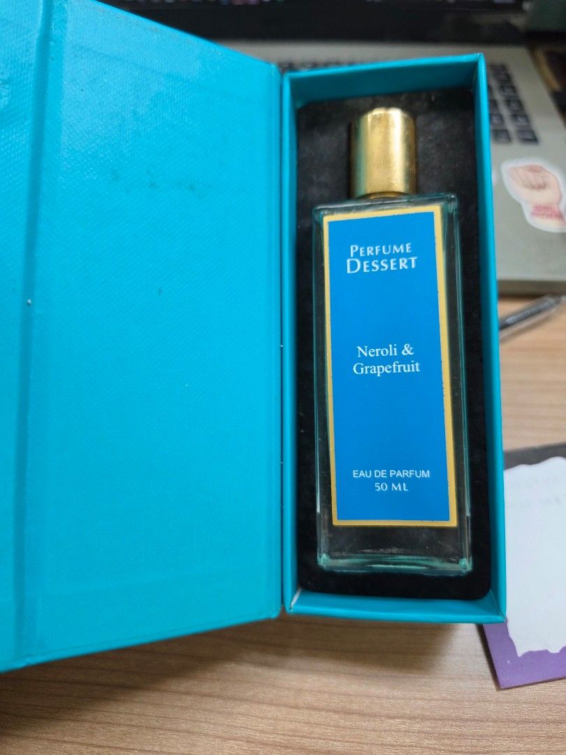 Perfume Dessert London Neroli & Grapefruit 50ml (Category: Fragrance & Deodorants) located in Manila. Submitted by _sj1204 (Listing ID 1466775580, Image 2). Description: - Brand: Perfume Dessert London - Scent: Neroli and Grapefruit - Concentration: Eau de Parfum - Size: 50ml - Condition: Brand new, unused, properly stored - Packaging: Comes in bright blue box with gold details and secure foam insert.