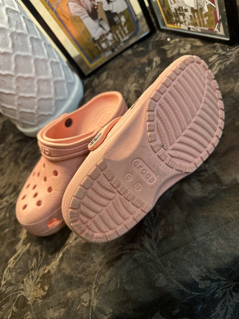 Pink Crocs Classic Clogs Size 12 (Category: Slippers and slides) located in Manila. Submitted by tenshiii185 (Listing ID 1466912535, Image 2). Description: - Classic pink Crocs for kids, Size 12 - Easy slip-on design with ventilation ports - Secure heel strap for active play - Perfect for everyday casual wear, the pool, or outdoor activities - Condition: Light scuffing on the soles from normal use.