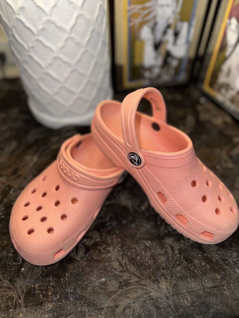 Pink Crocs Classic Clogs Size 12 (Category: Slippers and slides) located in Manila. Submitted by tenshiii185 (Listing ID 1466912535, Image 1). Description: - Classic pink Crocs for kids, Size 12 - Easy slip-on design with ventilation ports - Secure heel strap for active play - Perfect for everyday casual wear, the pool, or outdoor activities - Condition: Light scuffing on the soles from normal use.