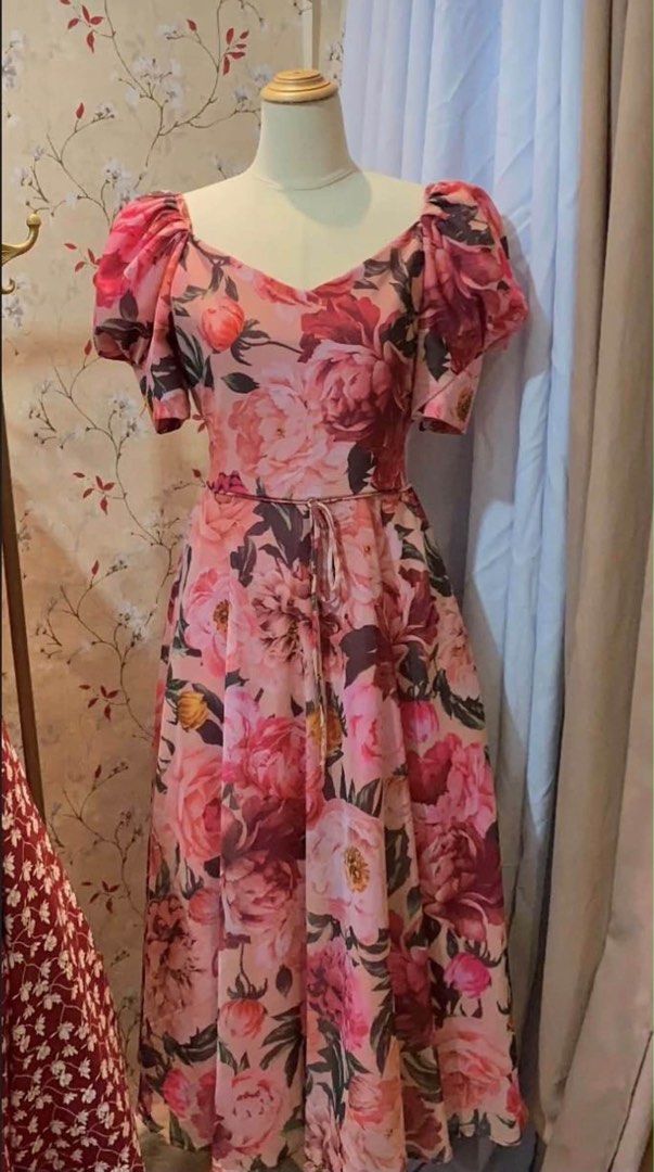 Bellakawaiinpink (Category: Dresses) located in Manila. Submitted by gemoliva (Listing ID 1466826905, Image 1). Description: - Pink maxi dress with eye-catching large floral prints - Sweetheart neckline and short puffed sleeves - Features a cute slim waist tie in the front - Flowy midi-to-long skirt for effortless movement - Comfortable pullover style - Ideal for garden parties, dates, or casual outings.