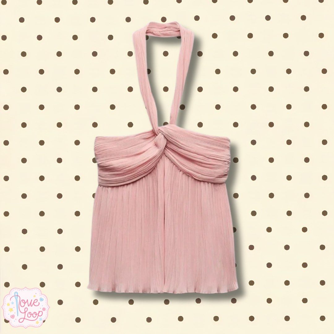 ZARA | Pink halter neck pleated top (Category: Sleeveless) located in Manila. Submitted by love.loop (Listing ID 1466891907, Image 1). Description: - Color: Soft pink - Design: Halter top with front twist and adjustable tie-neck straps - Material: Lightweight, fully pleated chiffon-like fabric - Fit: Flowy and flattering - Occasion: Ideal for dates, parties, or warm weather - Styling: Looks great paired with high-waisted jeans or a skirt.