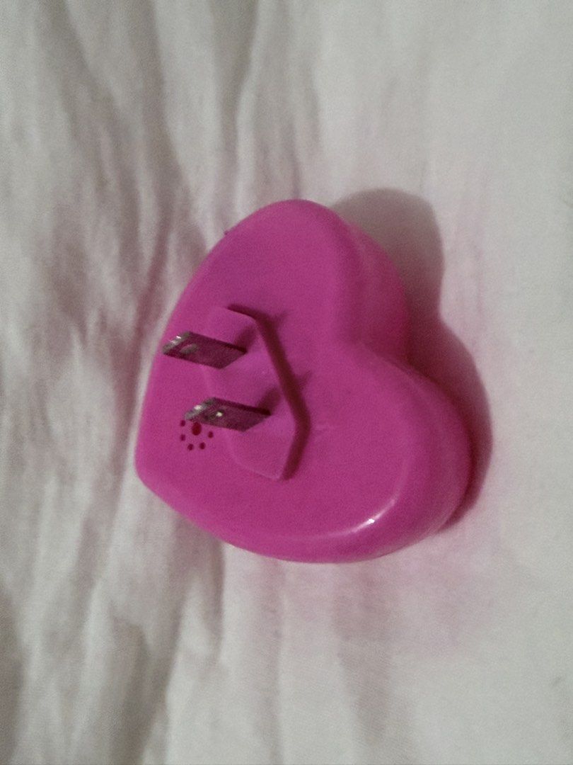 Pink Heart LED Plug-In Night Light (Category: Lighting) located in Taguig. Submitted by mengxir20193848 (Listing ID 1466812878, Image 3). Description: - Adorable heart-shaped design - Emits a gentle, relaxing soft pink glow - Convenient side switch for easy on/off control - Standard two-prong plug fits regular wall outlets - Compact and space-saving.