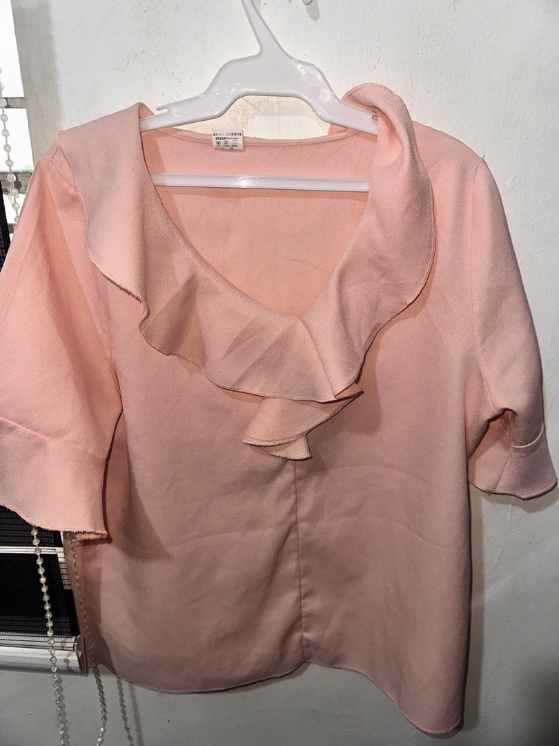 Pink Ruffle Collar Short Sleeve Blouse (Category: Blouses) located in Batangas. Submitted by egvdreamer (Listing ID 1466861841, Image 1). Description: - Color: Light Pink - Style: Relaxed fit V-neck blouse with a trendy wide ruffle collar - Sleeves: Short sleeves - Material: Soft textured fabric - Versatile: Great for casual daily wear or office outfits - Easy to style: Looks great with jeans, slacks, or skirts Sta rosa laguna.