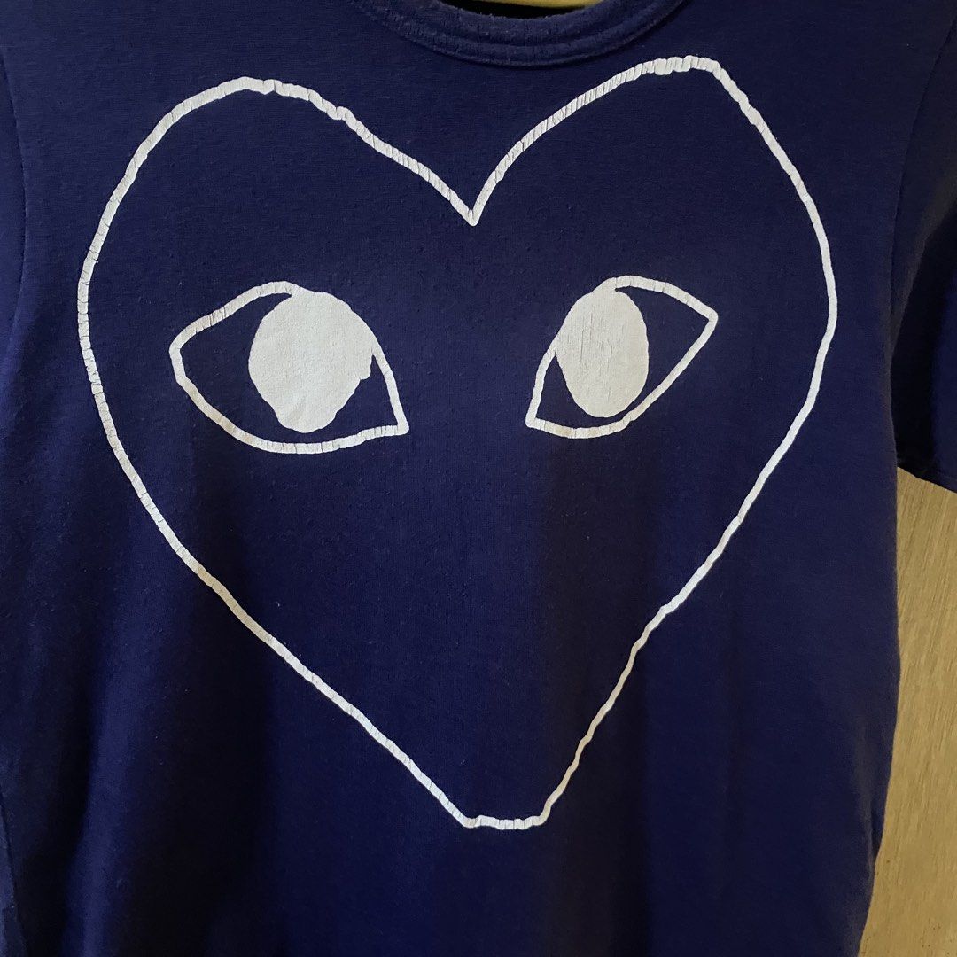 Play CDG Outline Shirt for Her (Category: Shirts) located in Baguio. Submitted by goodfinds2600v2 (Listing ID 1466892543, Image 2). Description: Size on tag: fits S-M Dimensions: L-24 W/Bust-15.5 Description: womens Condition: Very good Issue/s: 8.5/10 color rate, cut washtag, print cracks .