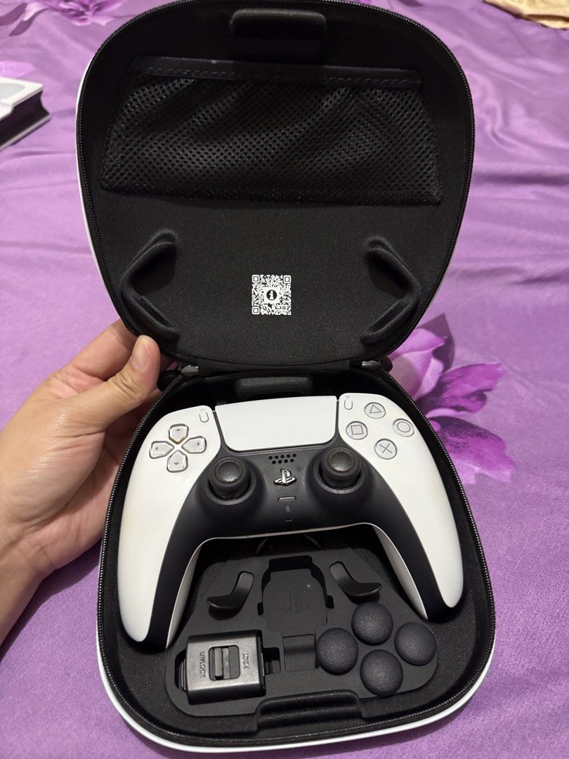 PlayStation DualSense Controller Case and Accessories (Category: Controllers) located in Taguig. Submitted by coolforest_006216 (Listing ID 1466810403, Image 2). Description: Genuine Sony PS5 DualSense wireless controller with carrying case and pictured accessories. Please refer to actual photos for condition and inclusions. Pre-owned and well-kept. RFS: Decluttering Location: Makati/BGC Delivery via Lalamove/Grab Express, buyer shoulders shippin