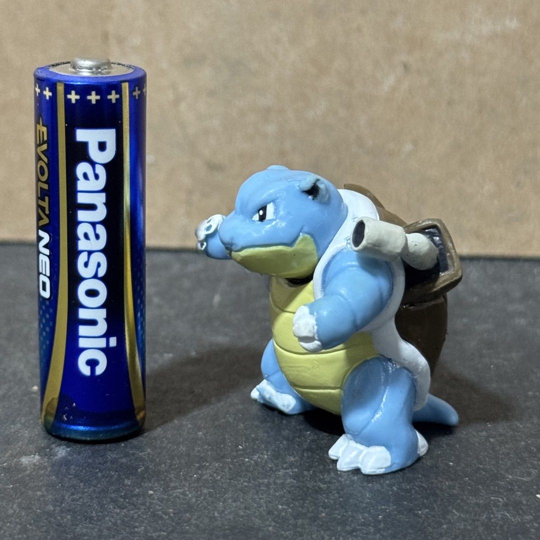 Pokemon Blastoise Mini Figure (Category: Figurines & Statues) located in Cuyapo. Submitted by blacksheepshop (Listing ID 1466787236, Image 2). Description: - Item: Genuine Pokémon Blastoise mini figure - Size: Stands about half the height of a standard AA battery - Details: Features molded shell cannons and official stamp on the back (Pokemon, B.China, 2656466 E) - Condition: Great compact collectible for display or gift - Shipping: Ships securel