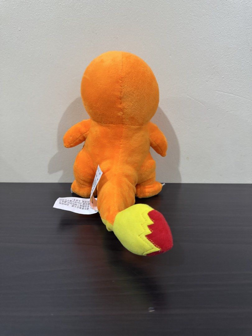 Pokemon Charmander Plush Toy (Category: Plushies & Soft Toys) located in Cainta. Submitted by mayhroeen (Listing ID 1466966386, Image 3). Description: - Item: Official Pokémon Charmander Plush - Condition: Like new, clean with no stains or damage - Details: Bright orange body, yellow belly, flame tail, embroidered blue eyes, and white claws - Authenticity: Official Pokémon tag still attached - Material: Ultra-soft plush fabric all over.