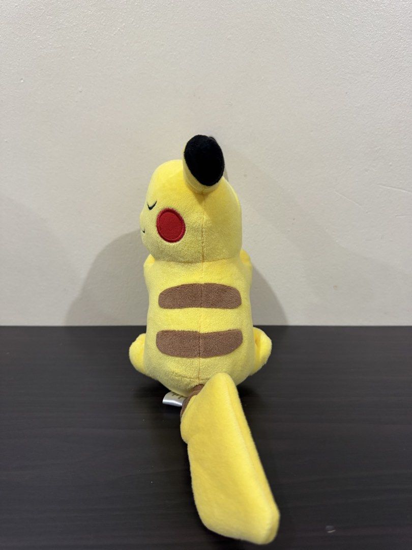 Pokémon Center Sleeping Pikachu 2018 Plush (Category: Plushies & Soft Toys) located in Cainta. Submitted by mayhroeen (Listing ID 1466966405, Image 2). Description: - Official Pokémon Center sleeping Pikachu plush (Released 2018) - Features an adorable sleeping pose with closed eyes - Iconic details: brown back stripes, red cheek patches, and lightning bolt tail - Verified authentic with original Nintendo and Game Freak tush tag - Perfect for col