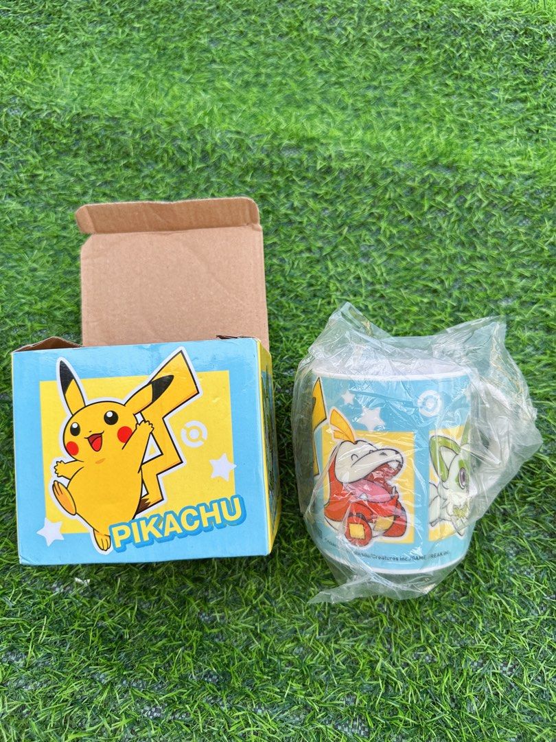Pokémon Pikachu Sprigatito Fuecoco Quaxly Ceramic Mug (Category: Coffee & Tea Tableware) located in Manila. Submitted by ronoarabbit.ph (Listing ID 1466884892, Image 1). Description: - Pokémon ceramic mug with Pikachu, Sprigatito, Fuecoco, and Quaxly designs - Features a light blue background with white stars, Poké Ball graphics, and subtle SoftBank/Y!mobile logos near the base - Brand new and never used (only removed from packaging for photos) -