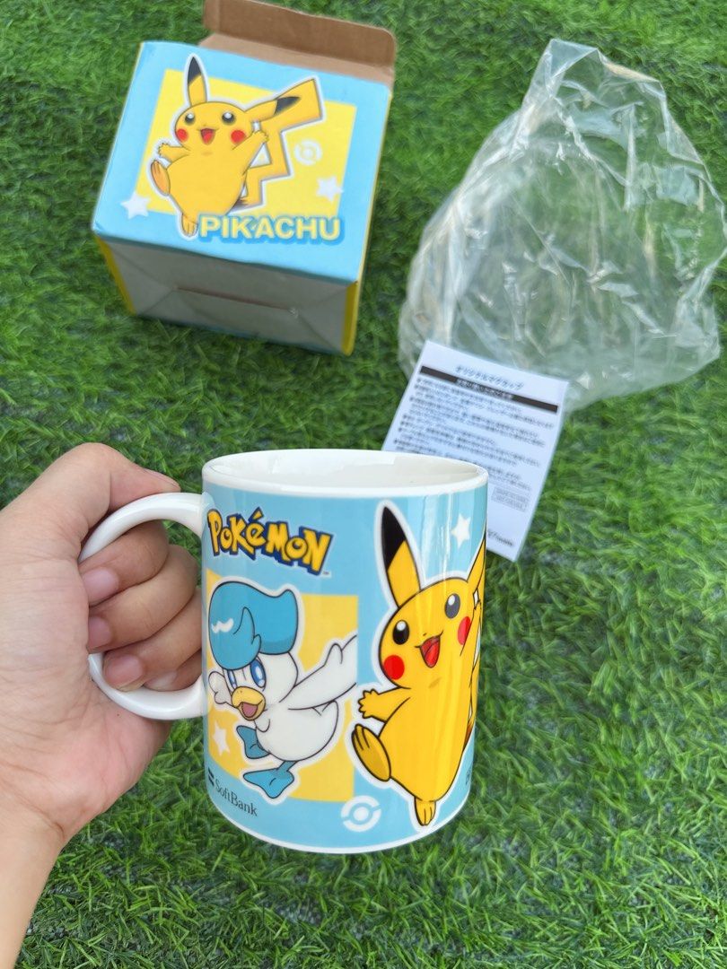 Pokémon Pikachu Sprigatito Fuecoco Quaxly Ceramic Mug (Category: Coffee & Tea Tableware) located in Manila. Submitted by ronoarabbit.ph (Listing ID 1466884892, Image 2). Description: - Pokémon ceramic mug with Pikachu, Sprigatito, Fuecoco, and Quaxly designs - Features a light blue background with white stars, Poké Ball graphics, and subtle SoftBank/Y!mobile logos near the base - Brand new and never used (only removed from packaging for photos) -