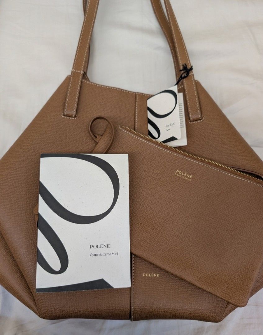 Polene Cyme good as new w/ receipt (Category: Tote Bags) located in Mandaluyong City. Submitted by kiraboo (Listing ID 1466877729, Image 2). Description: - Polène Cyme Regular Size - with tag - with digital proof of purchase - with dustbag - no box - dm for more photos - used once - Very good pristine condition - looks brand new RFS Decluttering - size not for me.