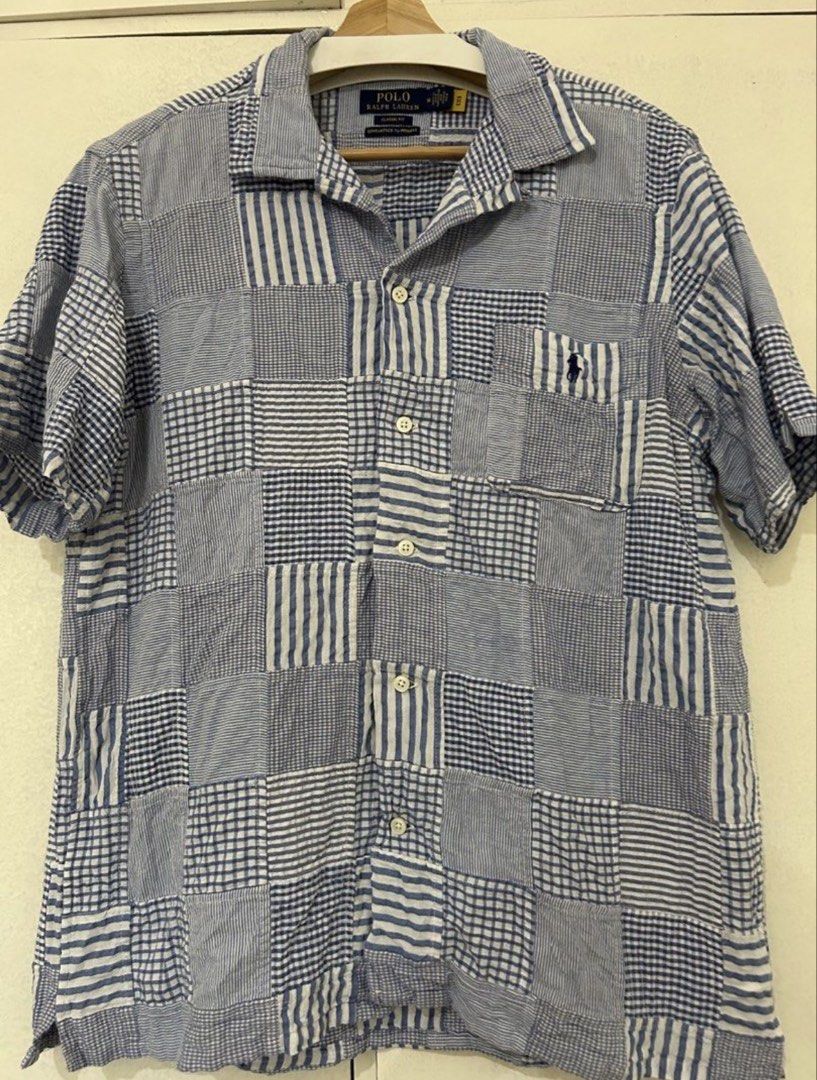 Polo Ralph Lauren Patchwork Seersucker Shirt (Category: Tshirts & Polo Shirts ) located in Paranaque City. Submitted by snkrsnstuff (Listing ID 1466862124, Image 1). Description: - Polo Ralph Lauren Patchwork Seersucker Shirt - Classic Fit - Size: Medium - Condition: used once, good as new - Blue & White Patchwork Design - Chest Pocket with Signature Polo Logo Dimensions: - Shoulders: 18in - Chest: 23in - Sleeve: 9.5in - Length: 29in.