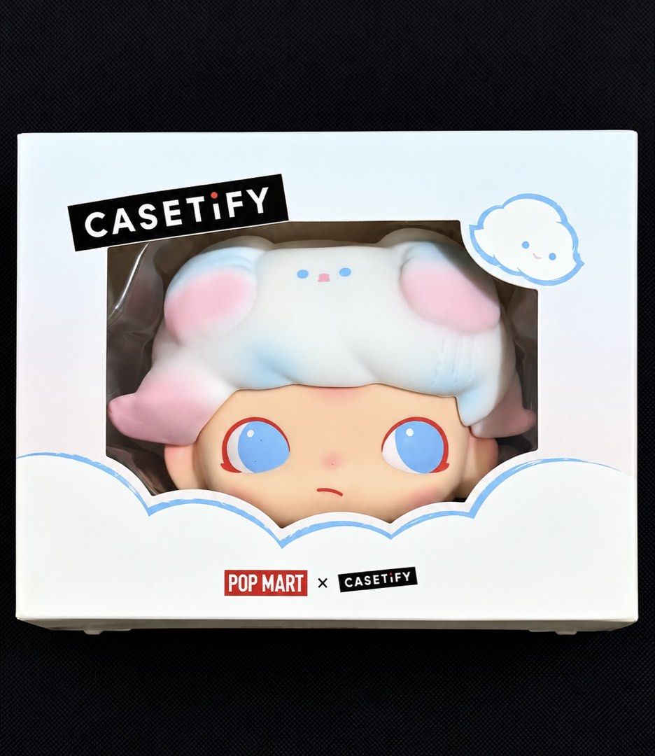 POP MART x CASETiFY Collectible Figure (Category: Designer & Blind Box Toys) located in Manila. Submitted by globetrotter143 (Listing ID 1466875783, Image 1). Description: Pop Mart x CASETiFY DIMOO Collectible 3D Earbuds Case (designed for AirPods Pro / AirPods Pro 2) inside its official packaging - Collaboration piece from Pop Mart and Casetify - Chunky cloud-style character design in pastel pink, blue, and white tones - Features big blue eyes a