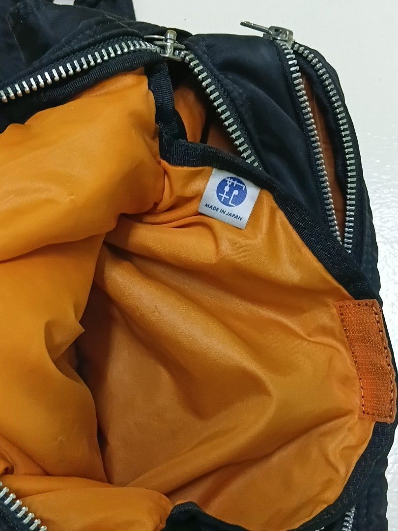 Porter Tanker Shoulder Bag Dark Navy (Category: Sling Bags) located in Manila. Submitted by daphnefinds (Listing ID 1466962255, Image 3). Description: - Authentic Porter Tanker messenger bag in dark navy nylon - Classic design featuring convenient front pockets with durable snap buttons - Secure zip closure for the main compartment - Comfortable, adjustable shoulder strap - Shows minor signs of wear on the fabric and woven label - Perfect, reliab
