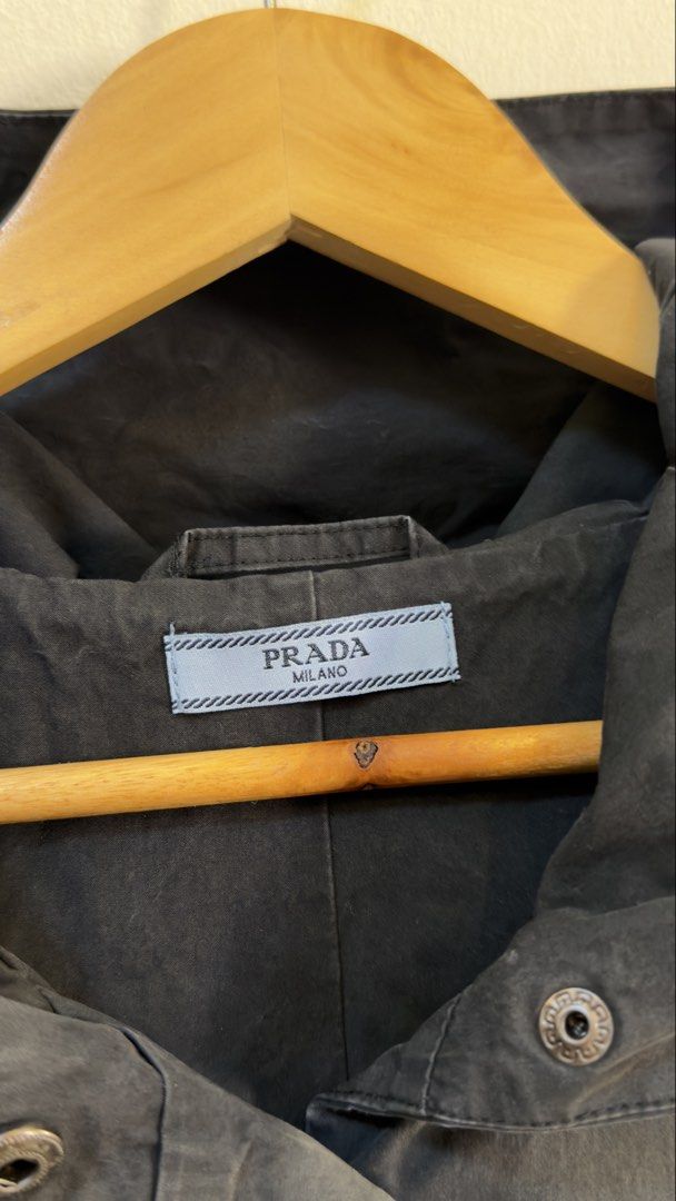 Prada Black Hooded Vest Size M (Category: Sleeveless) located in Paranaque City. Submitted by mykapoynton (Listing ID 1466960583, Image 3). Description: Prada Black Hooded Vest Size M - Color: Black - Size: Medium - Snap button front closure - Two front utility pockets - Iconic Prada triangle logo plaque on chest - Drawstring hood & sleeveless design - Clean interior lining with branding tag - Perfect layering piece for cooler weather.