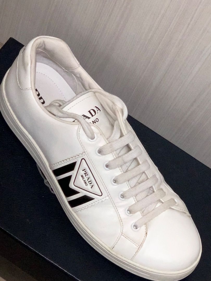 Prada Leather Sneakers White Black with Original Box (Category: Sneakers) located in Caloocan City. Submitted by christian_07deo (Listing ID 1466910781, Image 2). Description: - Authentic Prada white leather sneakers - Features stylish black side stripes and iconic triangle logo - Clean white leather upper with matching laces - Durable rubber sole for everyday wear - Includes original black Prada branded shoebox - Great luxury staple for your dai
