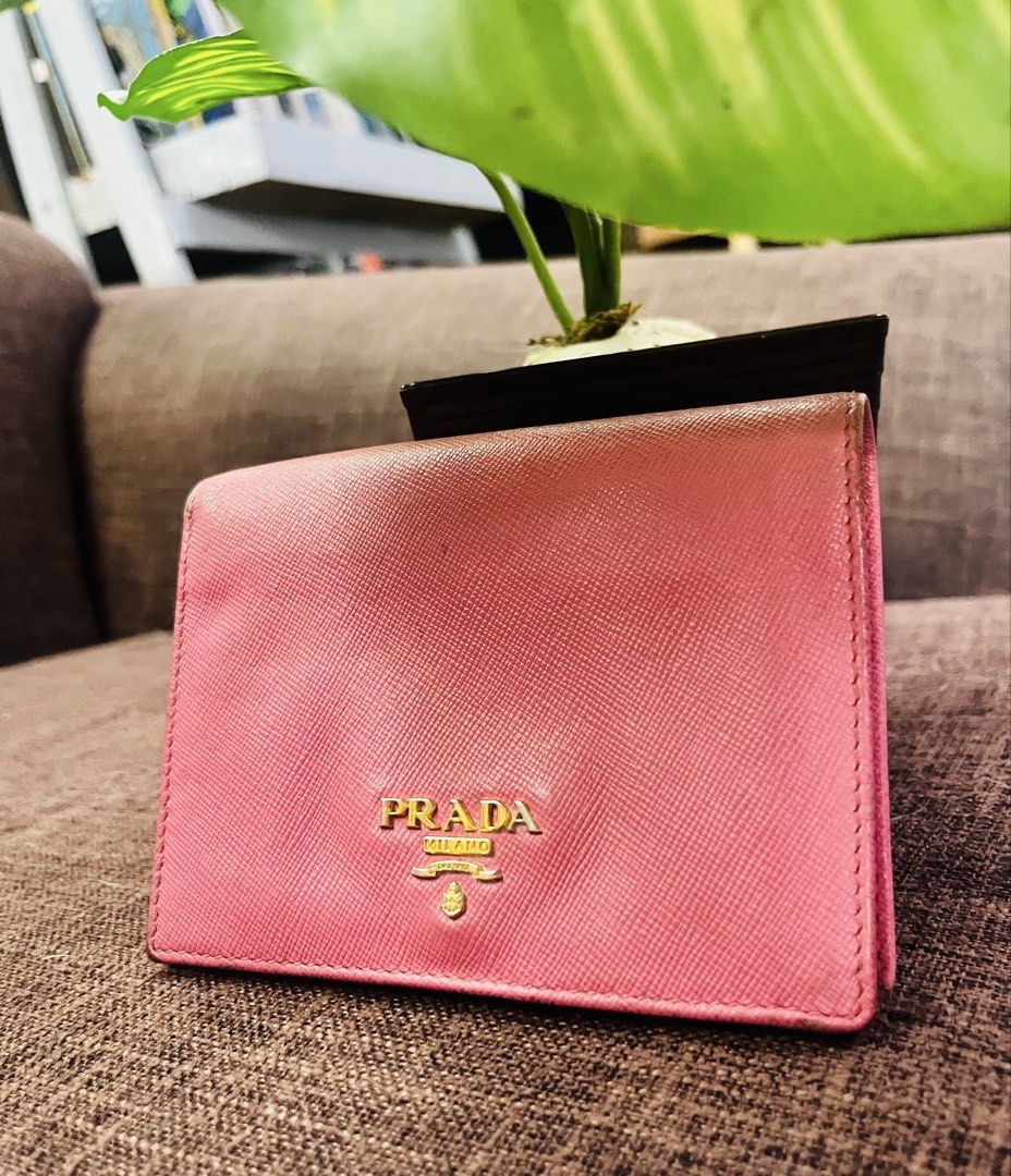 Prada (Category: Wallets & Card holders) located in Quezon City. Submitted by retann (Listing ID 1466969507, Image 1). Description: Authentic with signs of usage Bifold wallet small in size Clean inside and out.